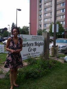 Andrea in front of the Dearborn Heights Co-op sign.